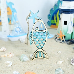 Detail of wooden fish ornament with blue starfish and rustic rope for beach home decor