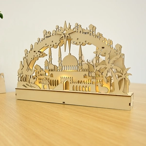 Detail of wooden Ramadan LED lamp with mosque and camel silhouettes and warm glow