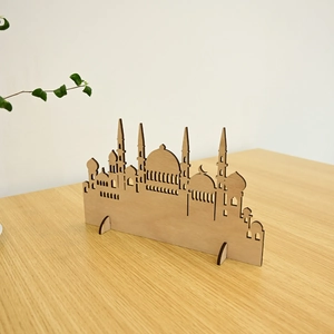 Detail of laser-cut wooden mosque ornament with intricate patterns for Muslim home decor