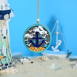 Detail of wooden ocean ball light with anchor carving and rustic hemp rope texture