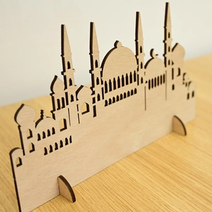 Detailed laser-cut wooden mosque silhouette ornament with intricate hollowed patterns