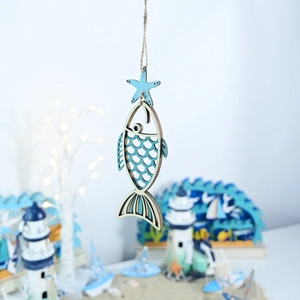 Detail of wooden ocean-themed starfish and fish pendant with laser-cut scales