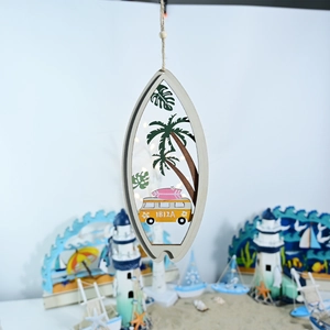 Close-up of laser-cut wooden surfboard decor with yellow bus and Ibiza lettering