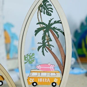 Detailed laser-cut wooden surfboard decor with tropical beach scene and Ibiza van
