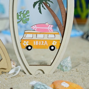 Detailed layered wooden surfboard decor featuring a yellow camper van and palm trees on sand
