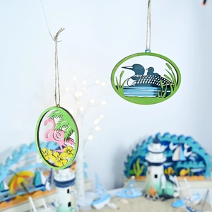 Detail of Mediterranean ocean style wooden wall hangings with flamingo and waterfowl motifs