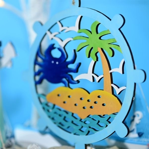 Macro shot of tiered wooden marine wall decor with blue crab and palm tree detailing