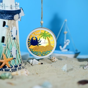 Detail of wooden ocean-themed LED orb featuring layered crab and palm tree carvings