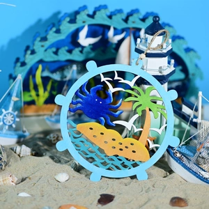 Detail of round wooden nautical wall decor featuring blue crab and palm tree on sand
