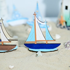 Mediterranean wooden sailboat decor with blue wave patterns on sand background