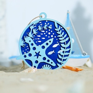 Detail of round wooden marine wall decor with layered nautical carvings and jute rope
