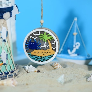 Detail of nautical layered wood LED lamp featuring a 3D crab and beach scene design