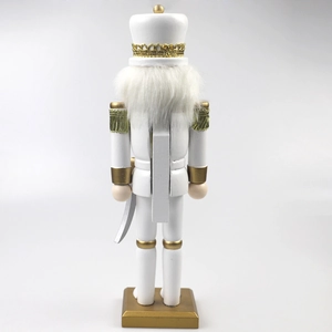 Detailed back view of 30cm white and gold nutcracker soldier with gold tassels and sword
