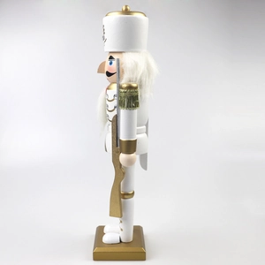 Side view of 30cm white and gold wooden nutcracker soldier with spear on a square base