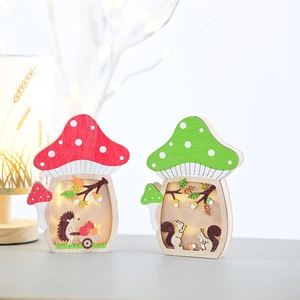 Detail of wooden mushroom LED night light with squirrel and forest scene carving