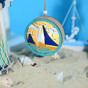 Macro detail of nautical wooden LED globe lamp with laser-cut sailboat and beach decor