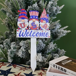 Detail of USA gnomes welcome sign for yard decor with patriotic stars and stripes theme