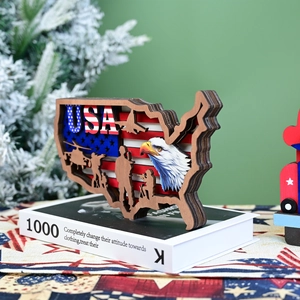 Detail of layered wood USA map ornament with flag eagle and soldier laser cutouts