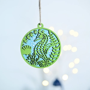 Detail of wooden sea horse wall hanging featuring laser-cut double layer design