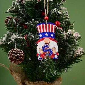 Patriotic wooden gnome ornament with USA flag patterns on a Christmas tree branch