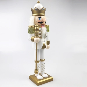 Detail view of 30cm white and gold wooden nutcracker soldier with crown and scepter