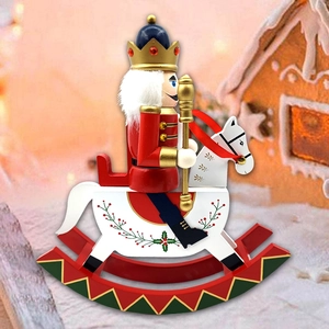 Detail of hand-painted wooden nutcracker soldier on a white rocking horse for Christmas decor