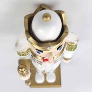 Top-down view of 30cm white and gold nutcracker king with crown and scepter