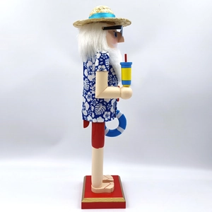 Side view of a Hawaiian Nutcracker in blue floral shirt with sunglasses and lifebuoy