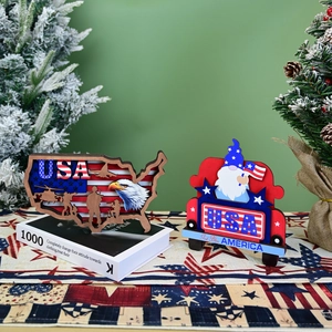 Detail of wooden USA map and red truck tabletop decor with patriotic eagle and gnome motifs