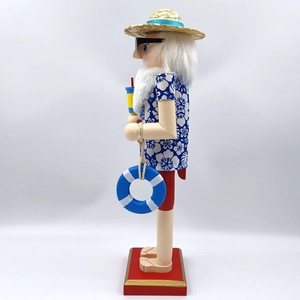 Close-up of tropical Santa nutcracker with Hawaiian shirt, straw hat and sunglasses