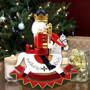 Detailed view of hand-painted wooden Nutcracker soldier on a white rocking horse