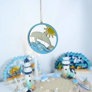 Detail of wooden layered marine hanging decor featuring a grey dolphin and blue waves