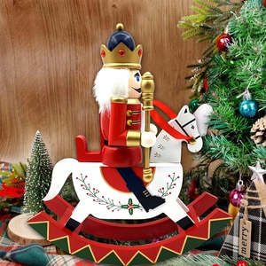 Detail of wooden nutcracker soldier on white rocking horse with golden crown and scepter