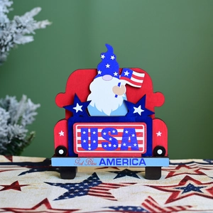 Patriotic wooden gnome in red truck ornament with USA flag and God Bless America text