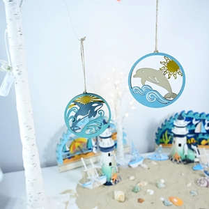 Detail of wooden ocean ornaments with dolphin and orca carvings on a decorative branch