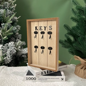 European abstract wooden key storage box with six metal hooks on green wall decor