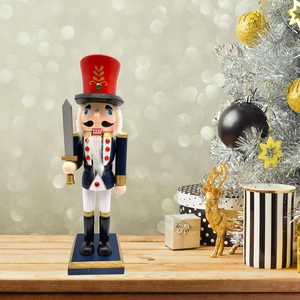 Macro view of a 25.5cm wooden nutcracker soldier with silver sword for Christmas decor