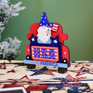 Detail of wooden gnome in red truck with God Bless America and USA inscriptions