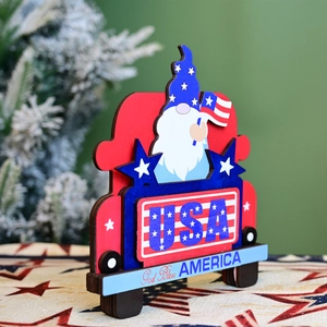 Detailed wood gnome in a red USA truck with God Bless America text for Independence Day