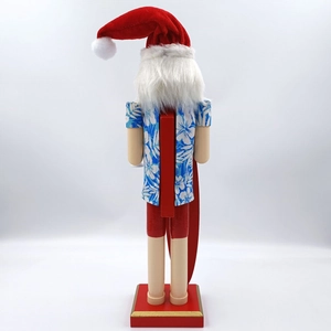 Back view of Hawaiian Santa nutcracker featuring blue floral shirt and red shorts detail