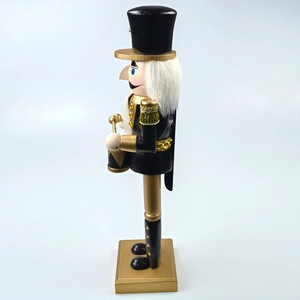Detail showing high-quality black and gold nutcracker drummer with luxury metallic finish
