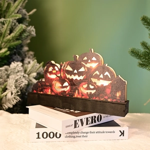 Halloween decorative wooden light with cutout pumpkin design and warm LED glow