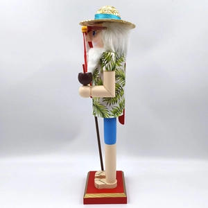Macro detail of tropical wooden nutcracker featuring palm leaf shirt and beach accessories