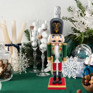 Close-up of 25.5cm wooden Nutcracker soldier with hand-painted details and golden sword