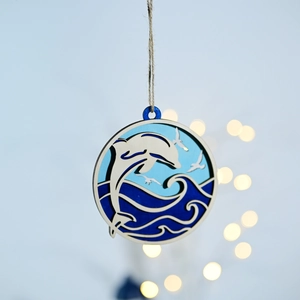 Detail of multi-layer wood carving dolphin leaping from ocean waves with jute rope