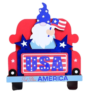 Patriotic gnome sitting on a red wooden truck with USA flag for Independence Day decor