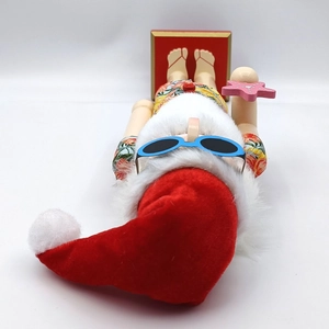 Detail of wooden tropical Santa nutcracker featuring sunglasses and floral swim trunks