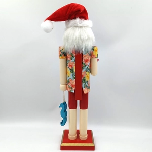 Detail of Hawaiian Santa nutcracker back featuring a tropical shirt and blue seahorse