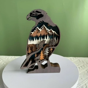 Handcrafted multi-layer wooden eagle silhouette with forest scenery and wildlife carving
