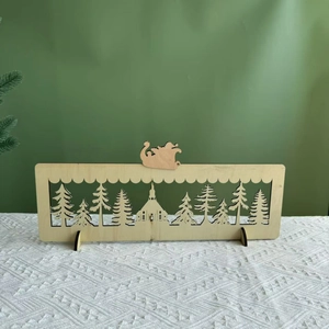 Detailed laser-cut wooden Christmas advent calendar with Santa and forest landscape scenery